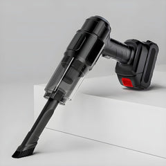 Black handheld vacuum cleaner with a brush attachment, angled downwards on a white stepped surface.