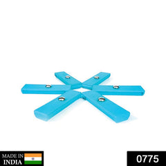 Versatile foldable hotmat in use as a non-slip trivet for a pan.