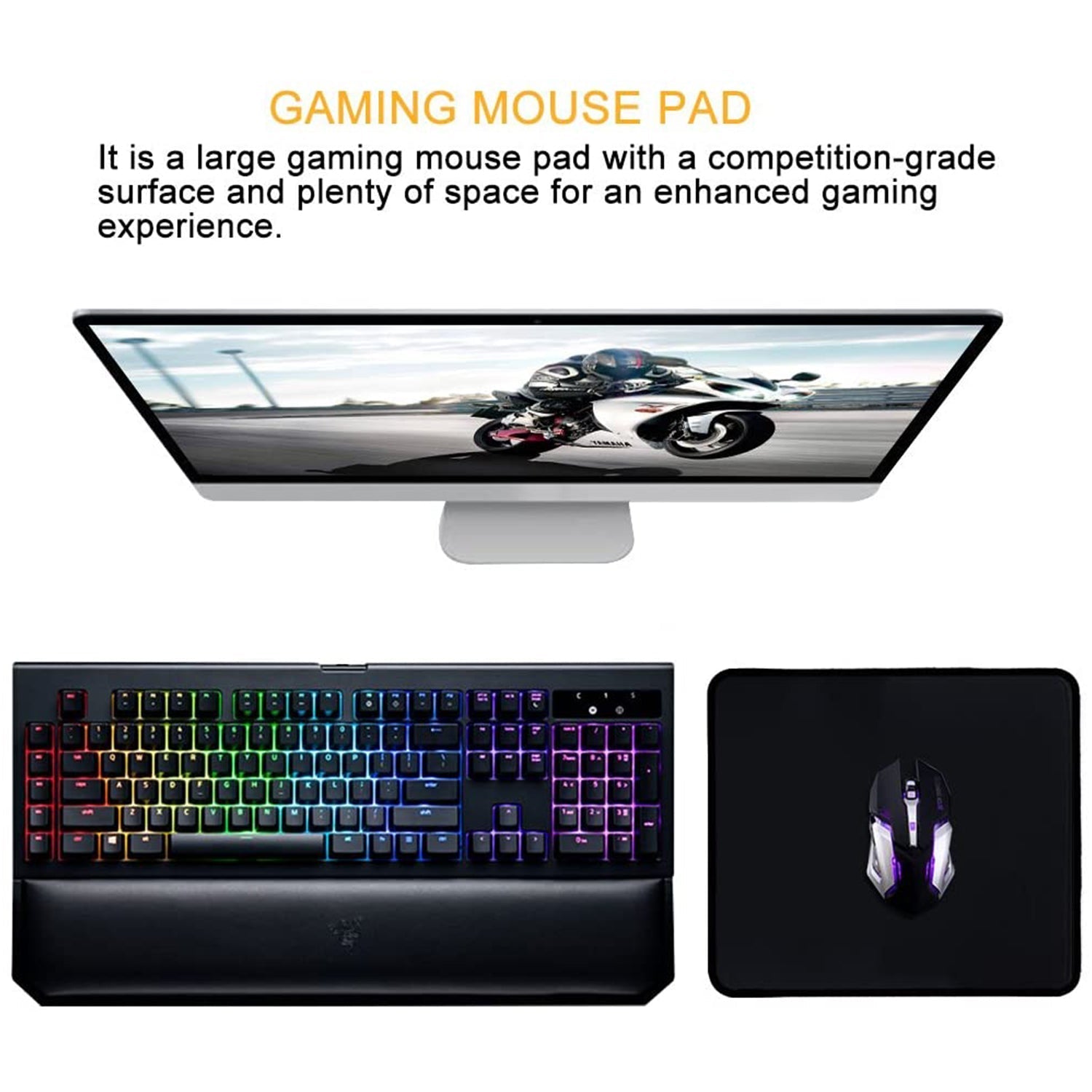 A black mouse pad with a gaming mouse next to a colorful gaming keyboard and a monitor displaying a motorcycle.