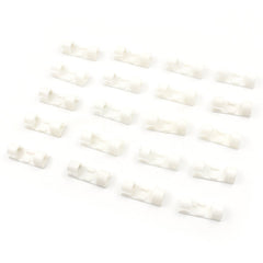 Twenty white plastic cable clips arranged in four rows of five on a clean white background.