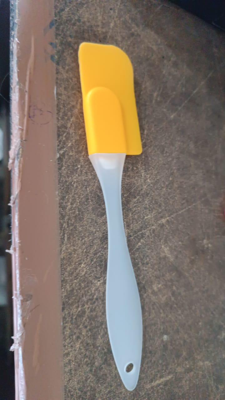 Vertical view showing the slim and compact design of the silicone cooking spatula.