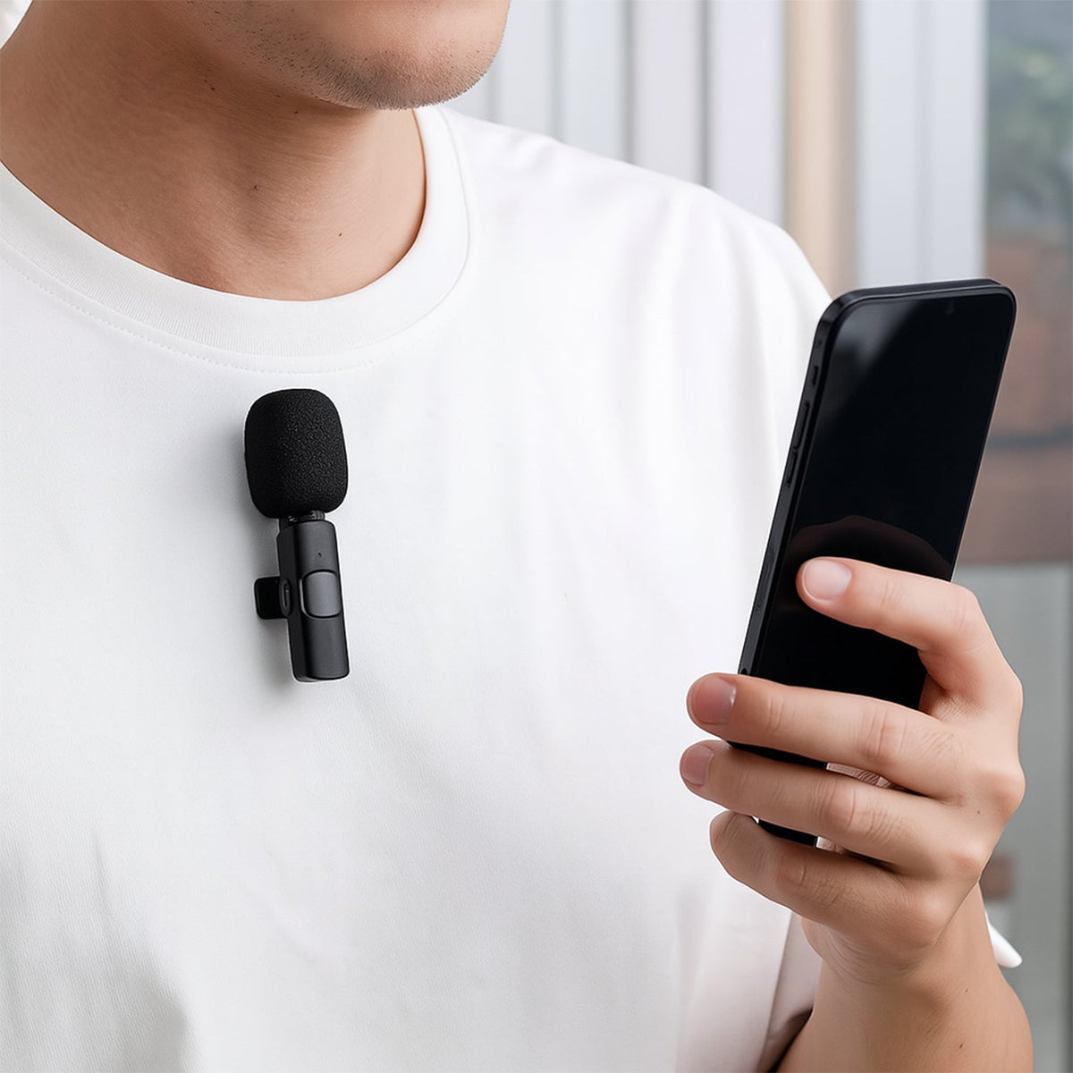 Compact wireless live streaming microphone with clip for mobile phones.