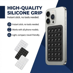 A grey phone with a black silicone suction holder, surrounded by white, black, and grey suction holders.