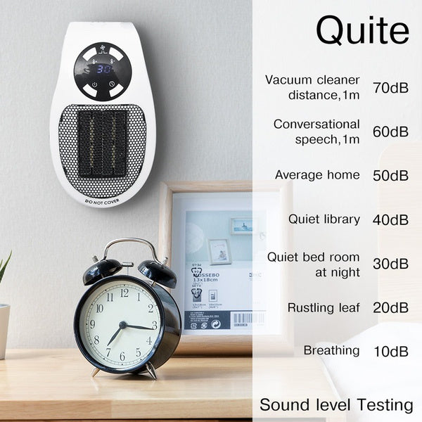 White and black wall heater plugged into a wall, next to an alarm clock and a sound level testing chart.