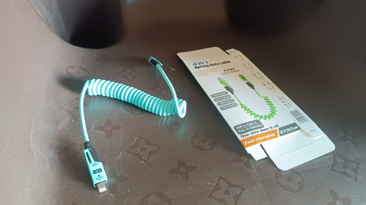 Display of 4-in-1 spring fast charging cable for versatile device use