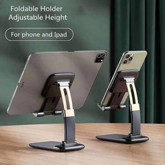 Two black and gold foldable stands, one holding a tablet and the other a smartphone, against a dark green curtain.