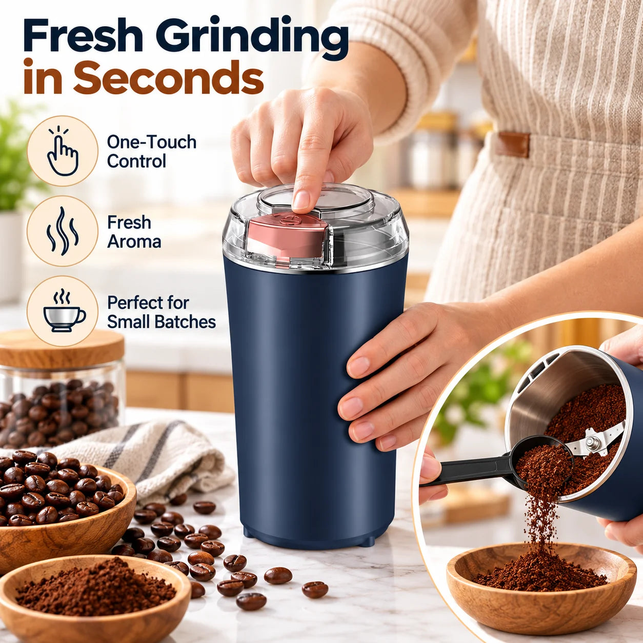 A person's hand pressing the button on a dark blue electric grinder, with coffee beans and ground coffee nearby.