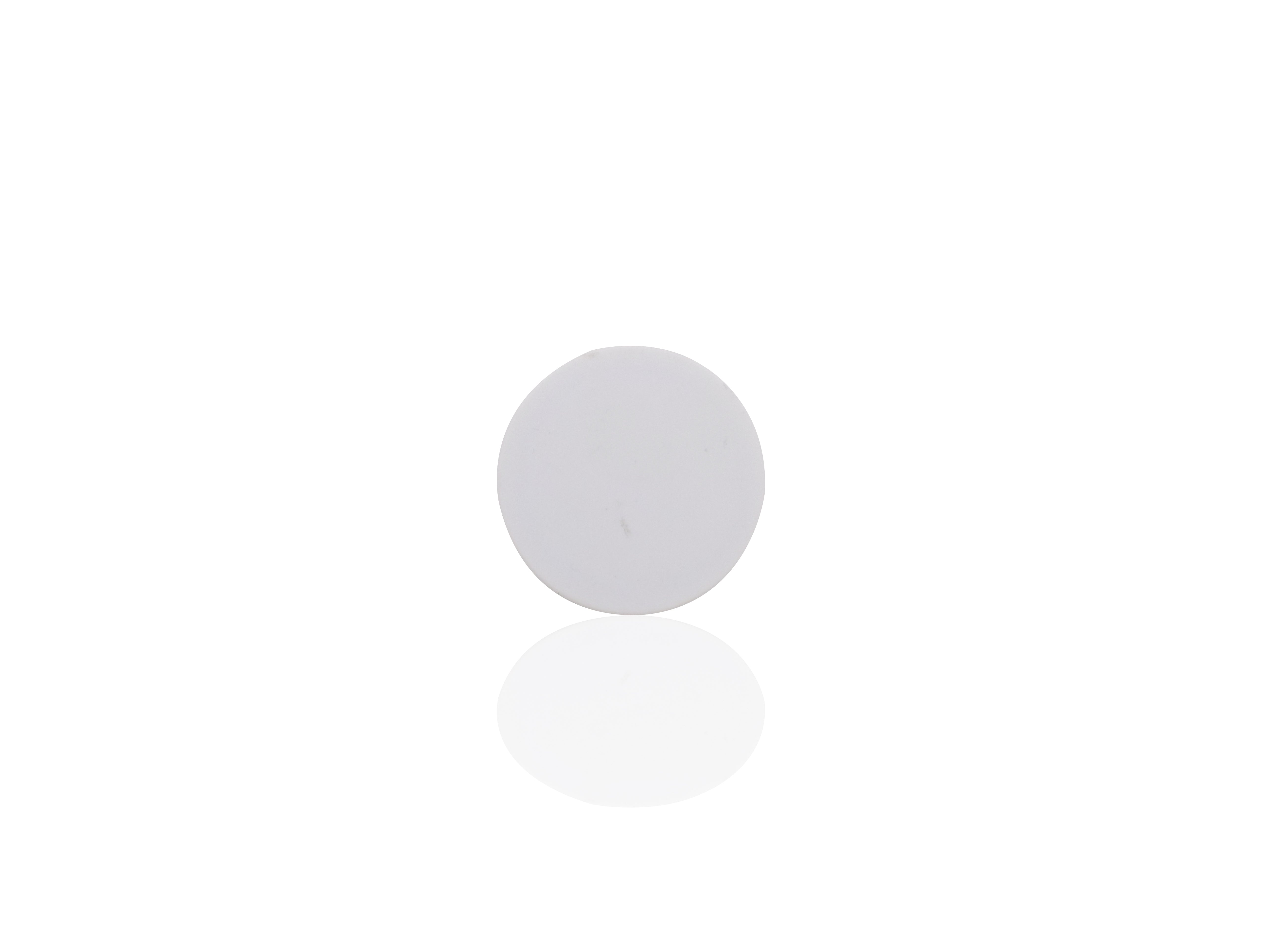 A single white phone grip is shown in its collapsed, flat state on a reflective white surface.
