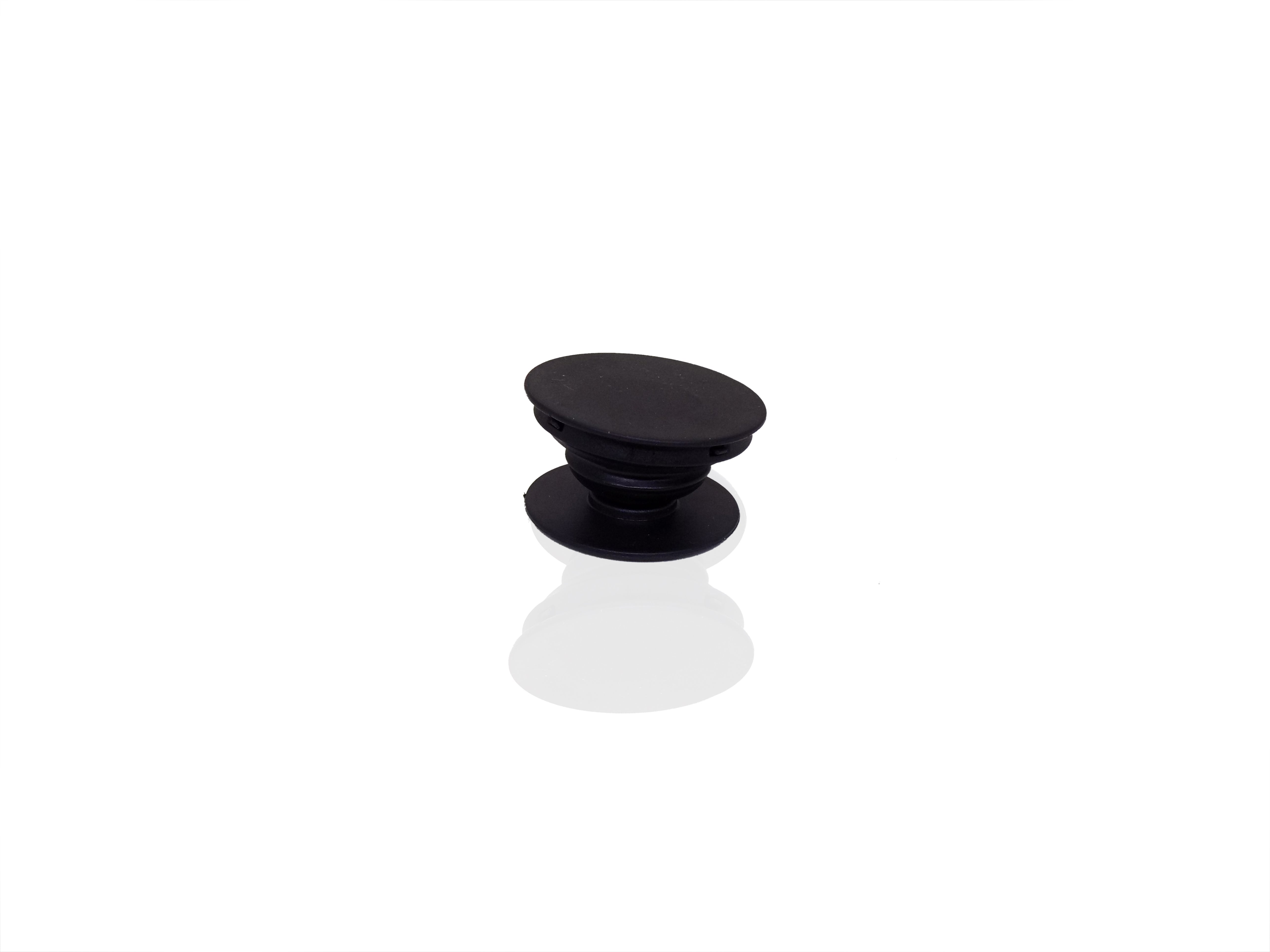 A single black phone grip is shown in its expanded state on a reflective white surface.