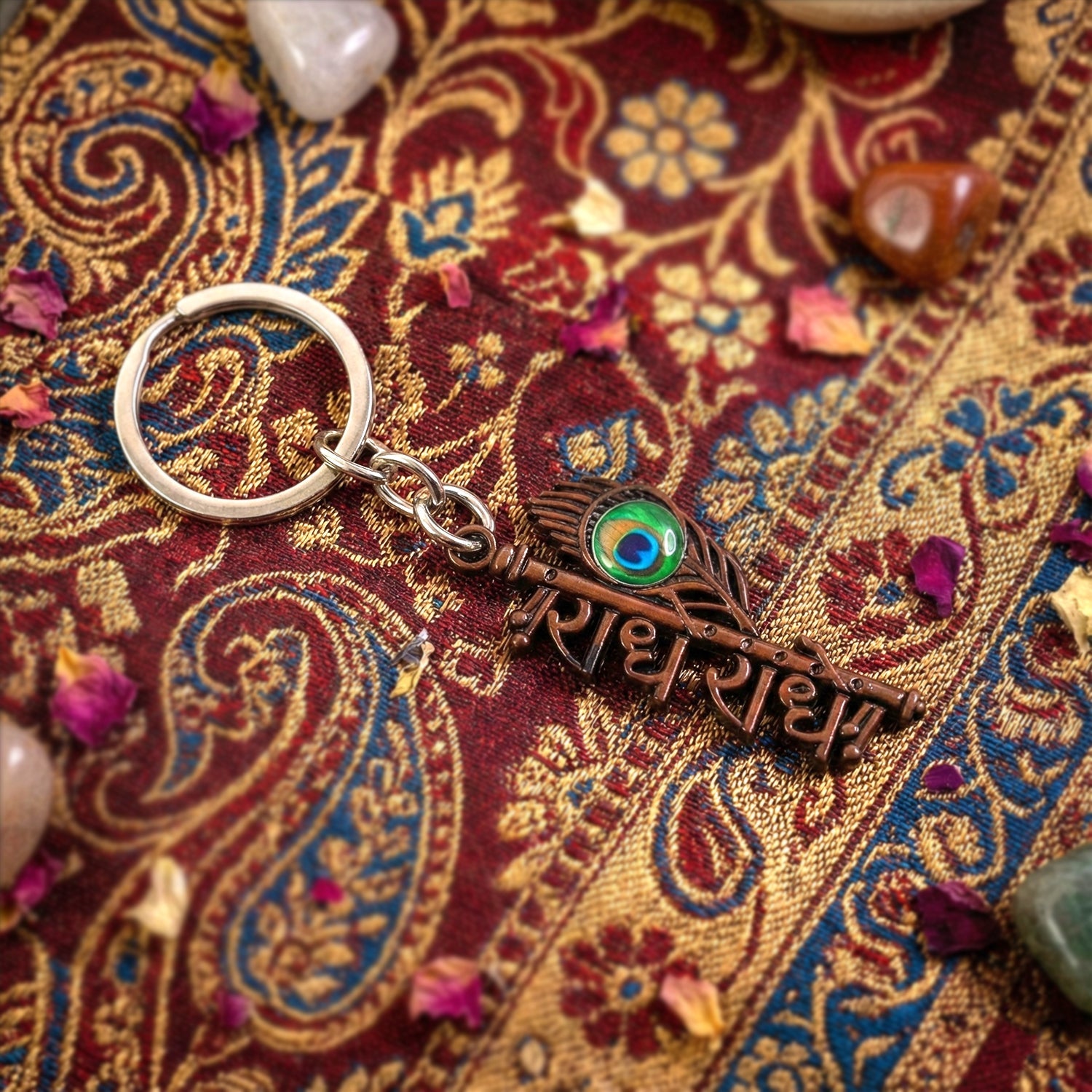 Full view of Radhe Radhe keychain with detailed peacock feather design
