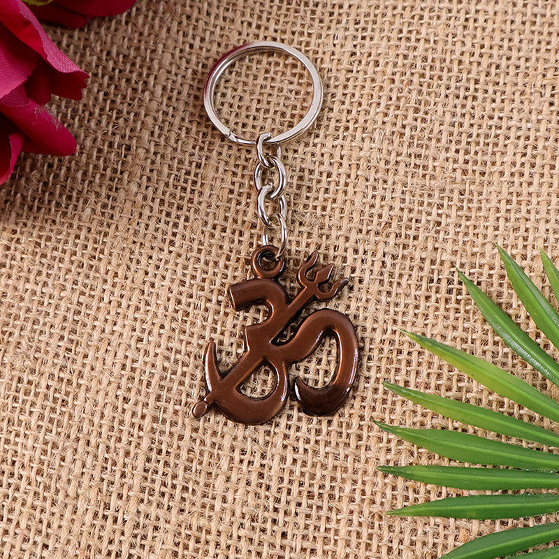 Om Trishul keychain with a smooth metallic finish and spiritual symbols