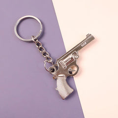 Side view of the stylish gun shape metal keychain, highlighting its durable construction.
