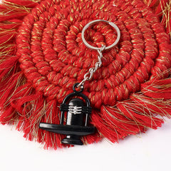 Elegant black Shivling metal keychain with detailed sacred markings
