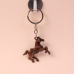 Side view of stylish metal horse design keychain