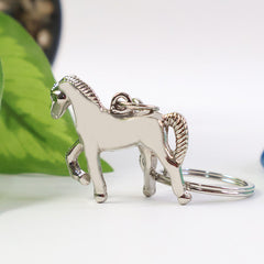Close-up of horse figure engraving on the stylish metallic keychain