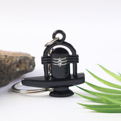 Side profile of Shivling keychain highlighting smooth polished black finish