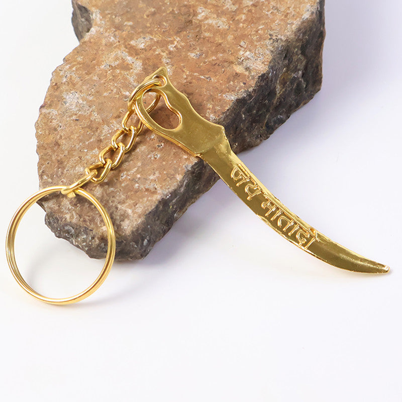 Golden Mataji sword style metal keychain attached to keyring