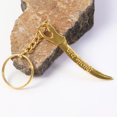 Golden Mataji sword style metal keychain attached to keyring