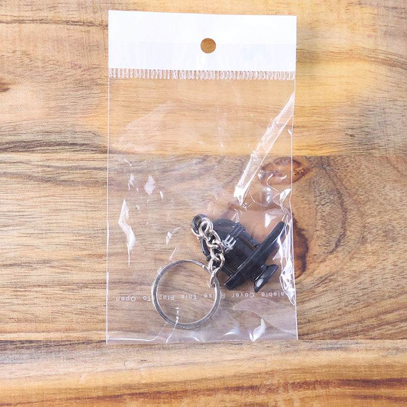 Black Shivling keychain symbolizing spirituality and durability
