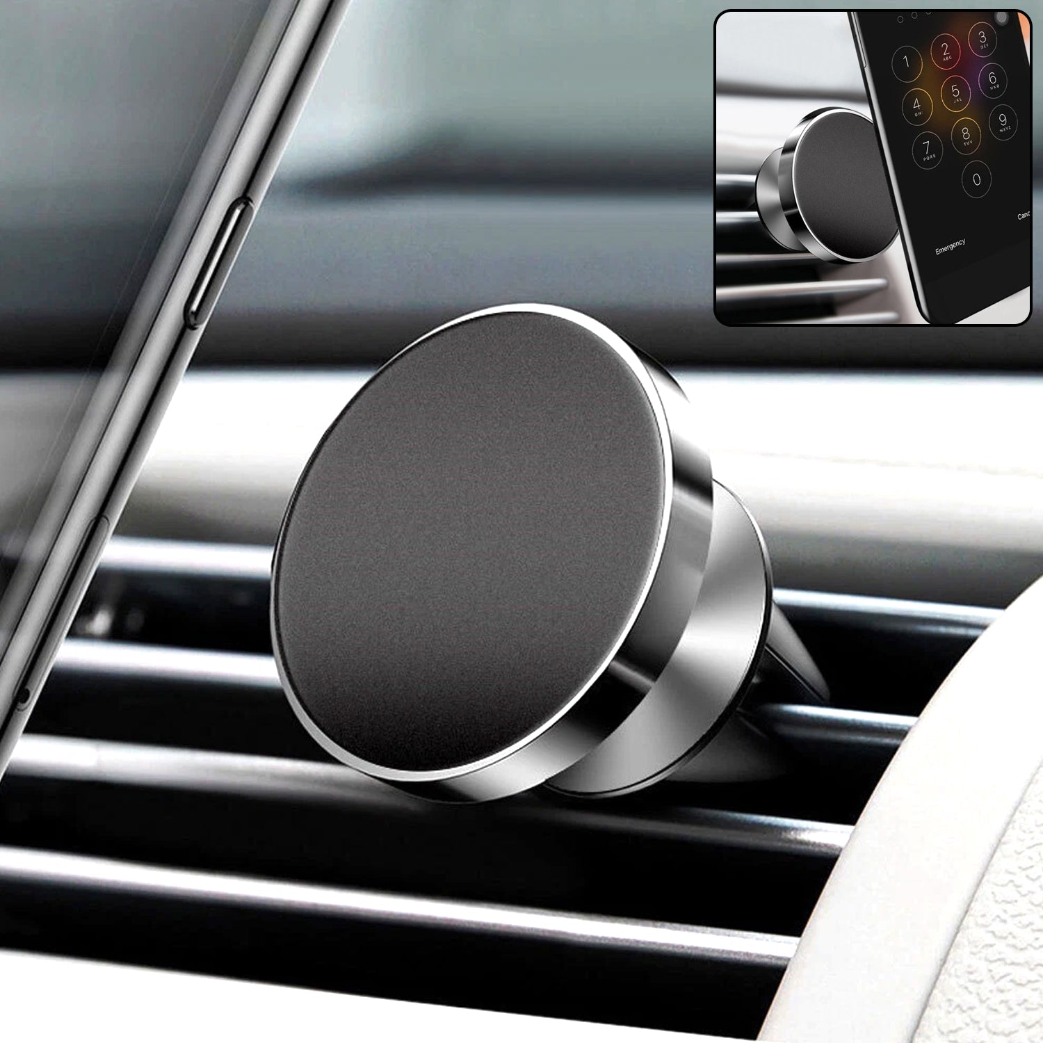 A close-up of a black and silver magnetic car mount on an air vent, with a phone visible in the background.
