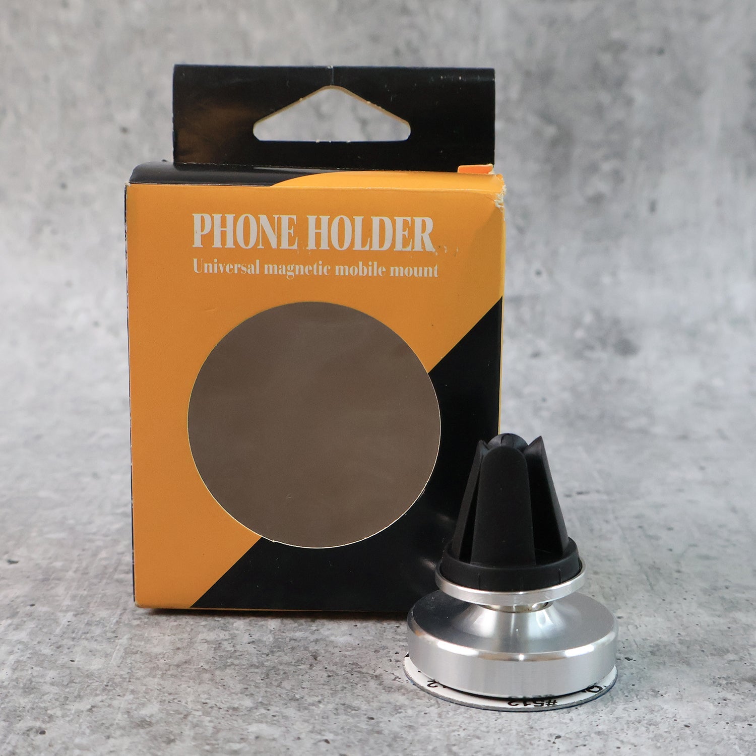 Rotating magnetic phone holder securing a smartphone on a car's air vent.