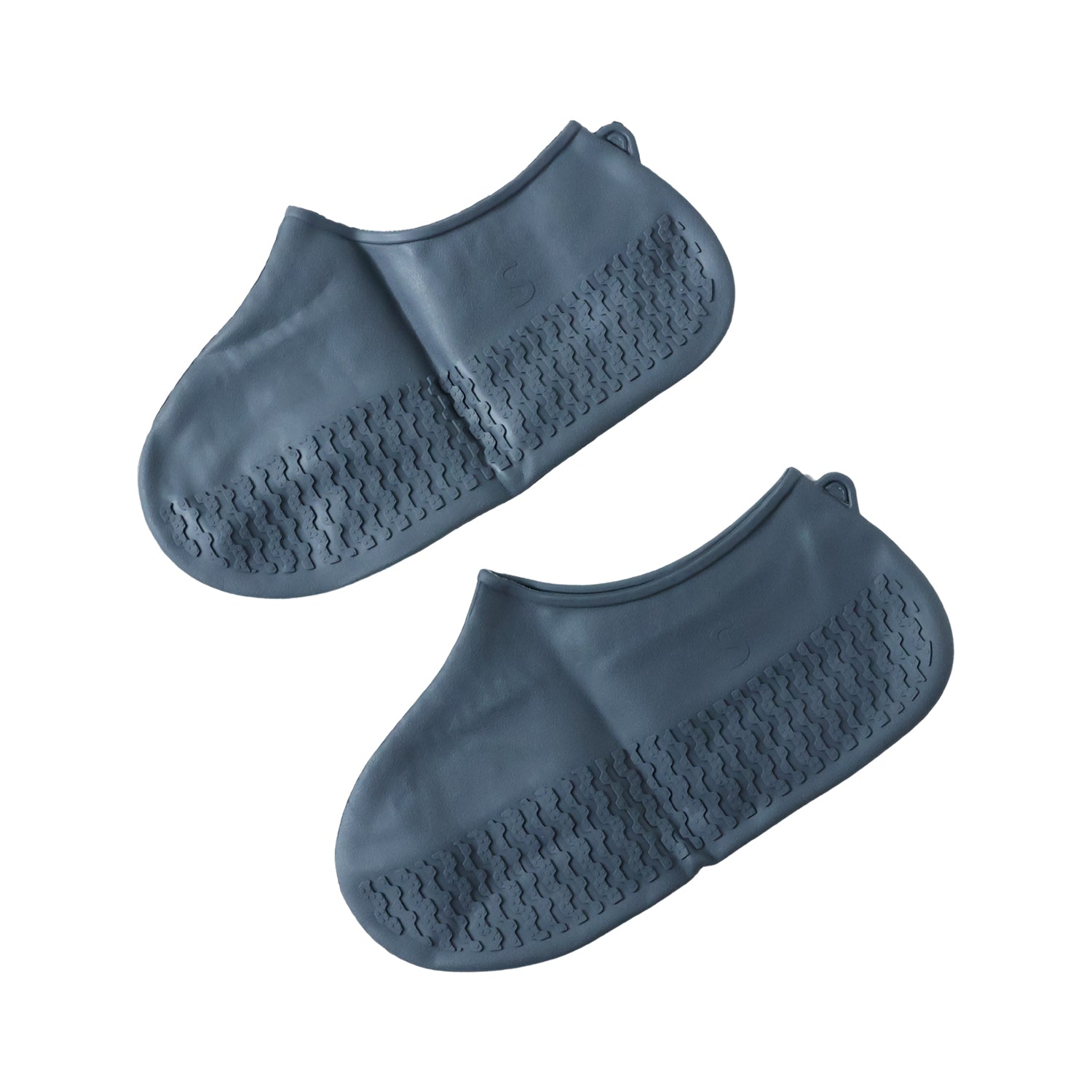 Two dark grey silicone shoe covers with textured soles are arranged on a plain white background.