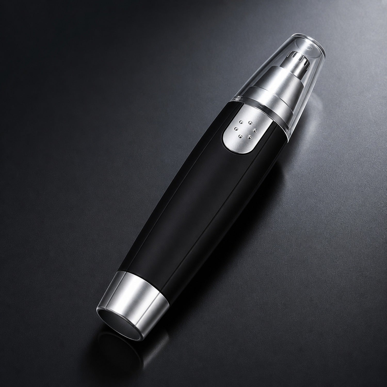 A black and silver nose hair trimmer with a clear cap is angled on a dark background.
