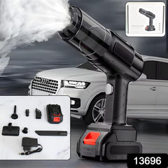 Black handheld vacuum cleaner expelling white mist, with various attachments and a charger displayed in the foreground, and