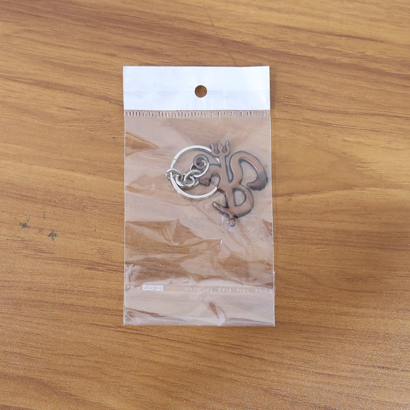 Om Trishul metal keychain displayed against a clean white background
