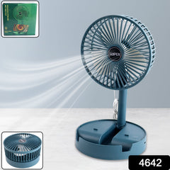 A teal portable fan with an adjustable stand blows air, with an inset of the fan in a compact form and its packaging.